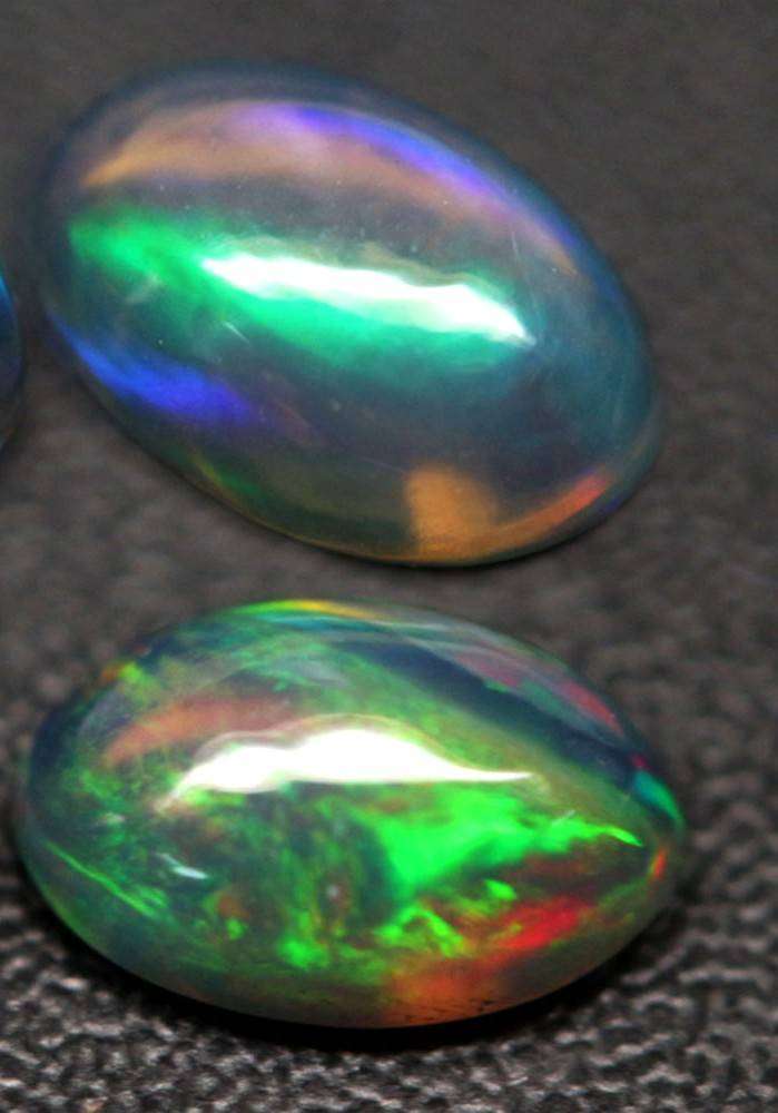 1.19Ct.Opal Oval Cabochon **4 Pieces**Multi Colors Glittering Rainbow 3D! Ethiopian  Natural