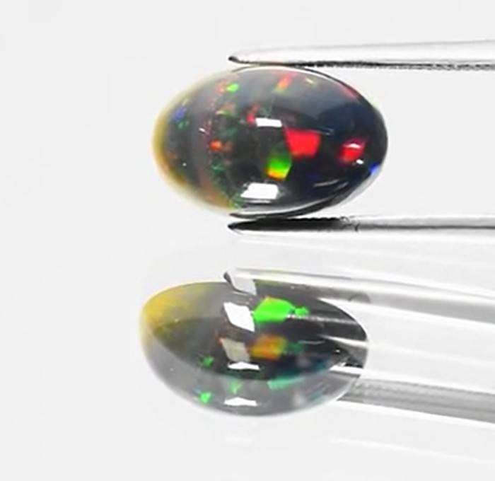 2.71Ct.Opal Oval Cab. Black Opal & Rainbow Color Sparkling  Ethiopia