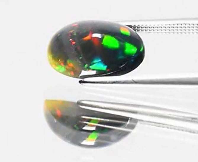 2.71Ct.Opal Oval Cab. Black Opal & Rainbow Color Sparkling  Ethiopia