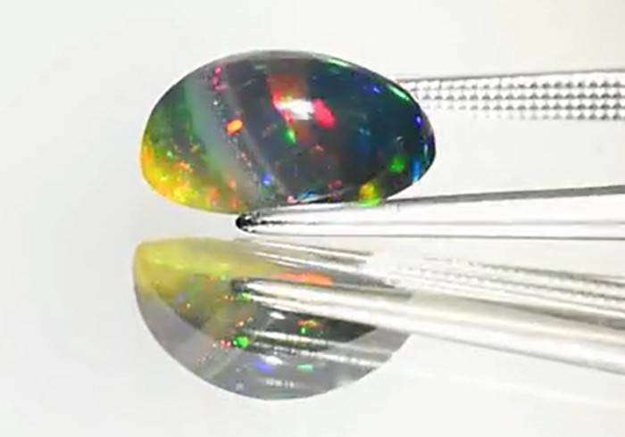 2.71Ct.Opal Oval Cab. Black Opal & Rainbow Color Sparkling  Ethiopia