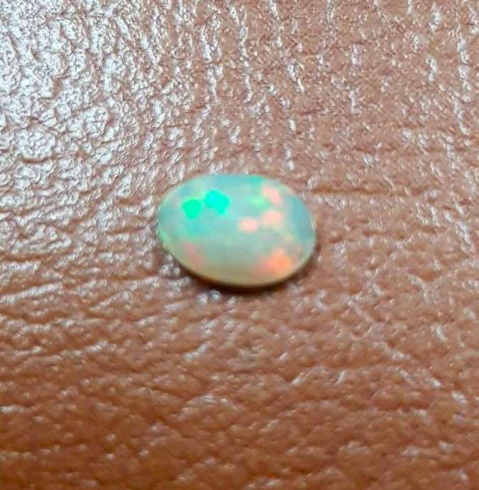 Opal 0.54Cts Oval Facetted 5x7mm Multi Colours Glittering Rainbow 3D! Ethiopian Natural