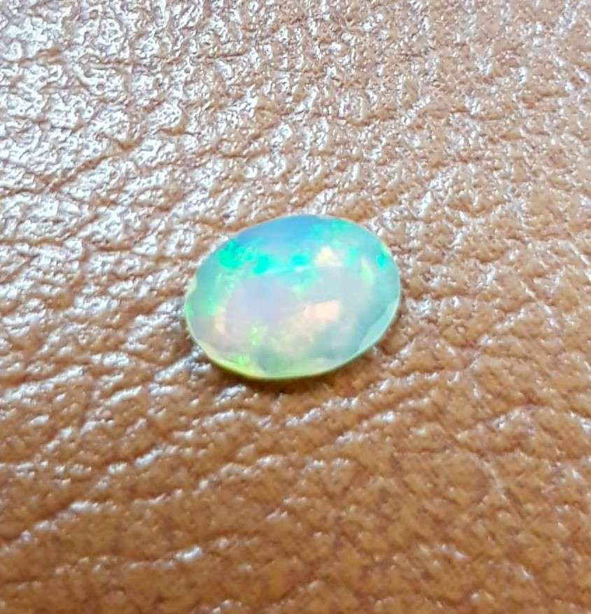 Opal 0.54Cts Oval Facetted 5x7mm Multi Colours Glittering Rainbow 3D! Ethiopian Natural