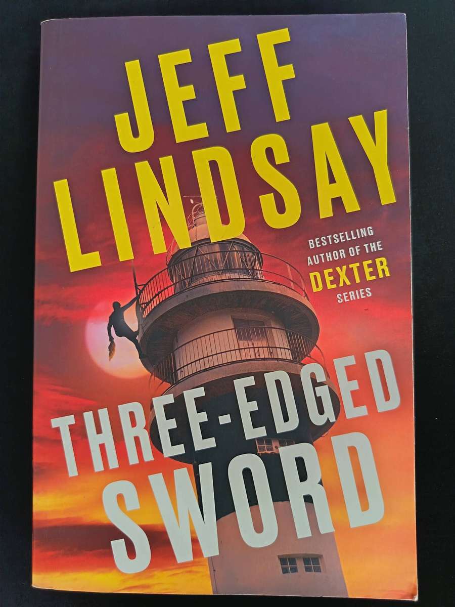 Three-Edged Sword by Jeff Lindsay