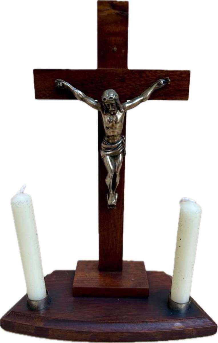 Vintage wooden crucifix with candles