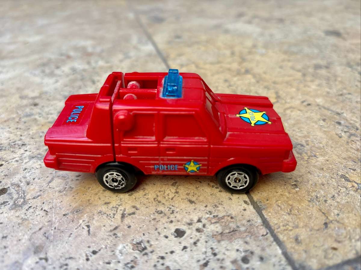 Vintage esso robot racer transforming police car pvc Hong Kong  1984