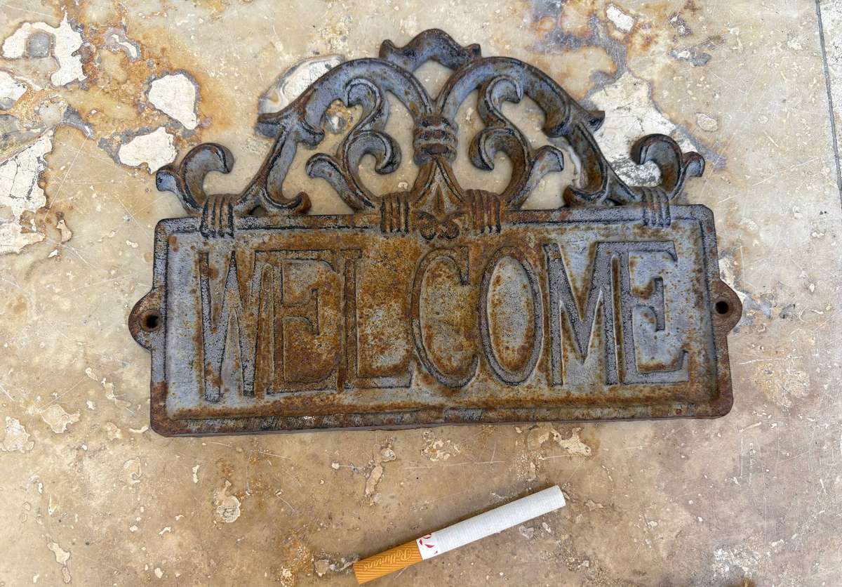 Vintage cast iron welcome sign rustic