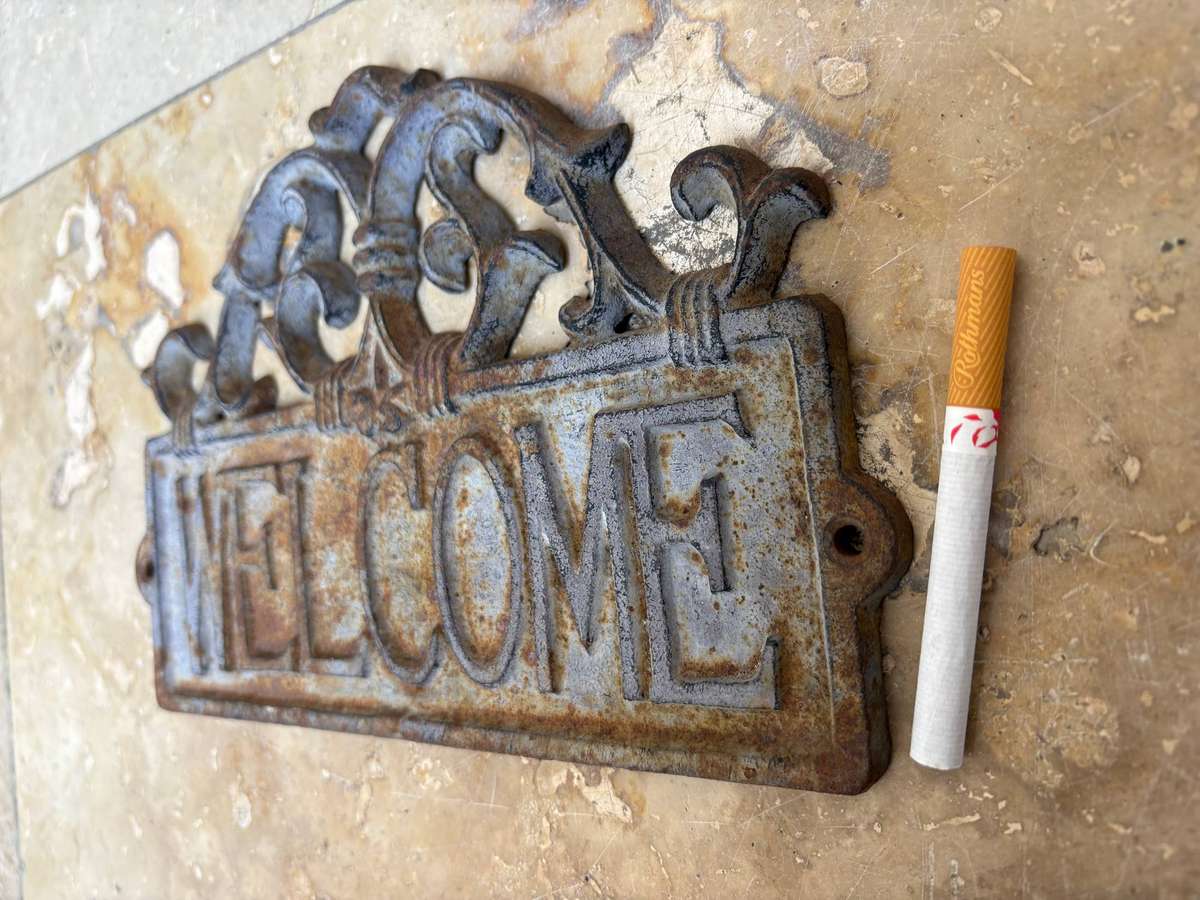 Vintage cast iron welcome sign rustic
