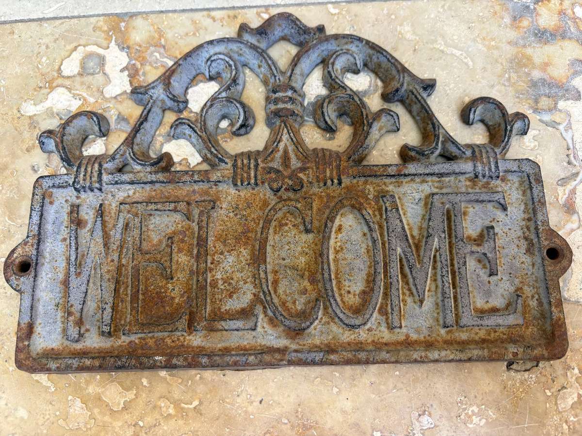 Vintage cast iron welcome sign rustic