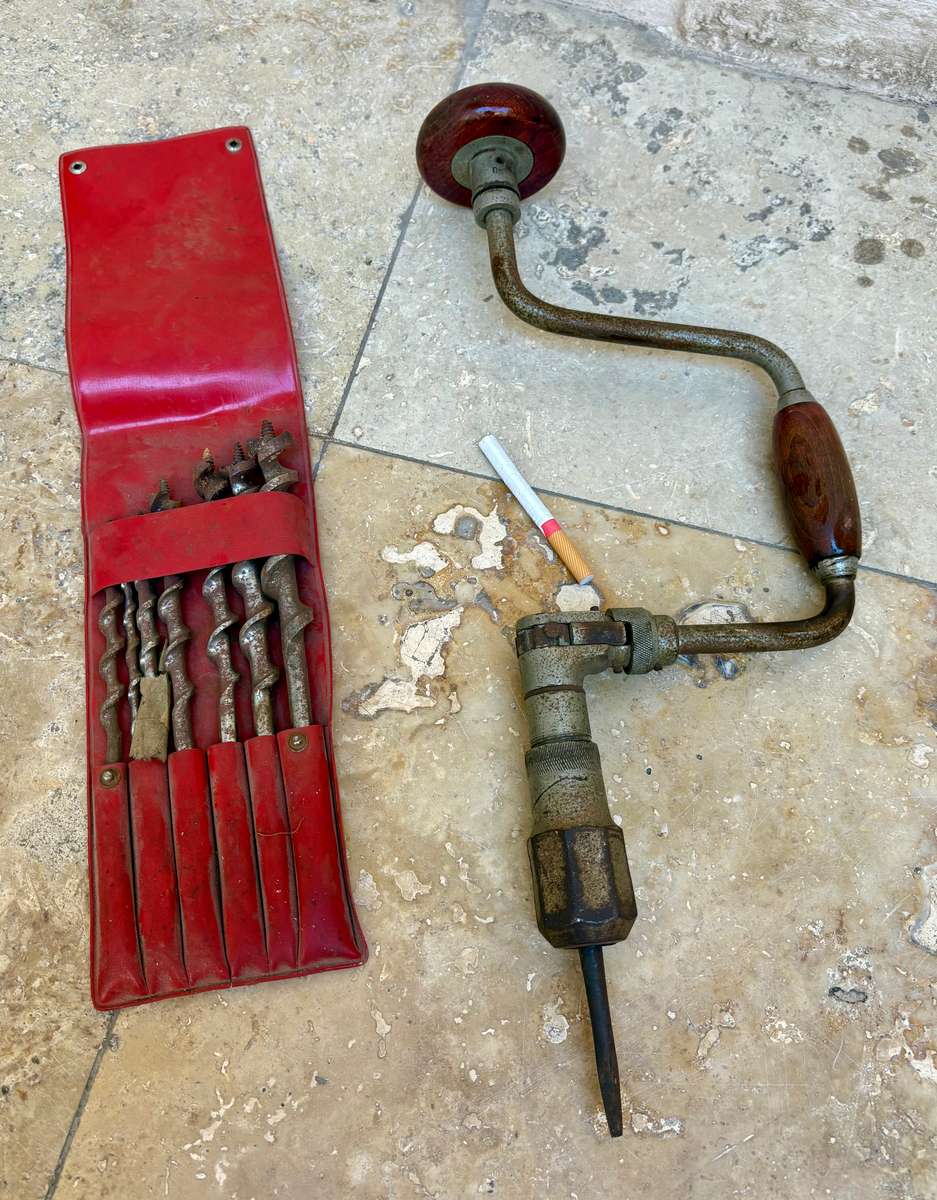 Vintage hand drill with drill bits
