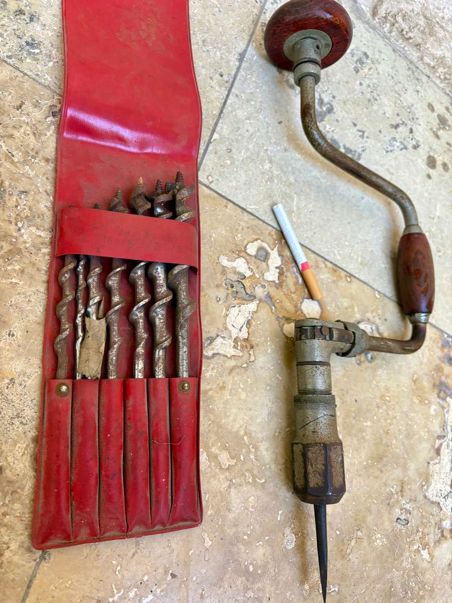 Vintage hand drill with drill bits