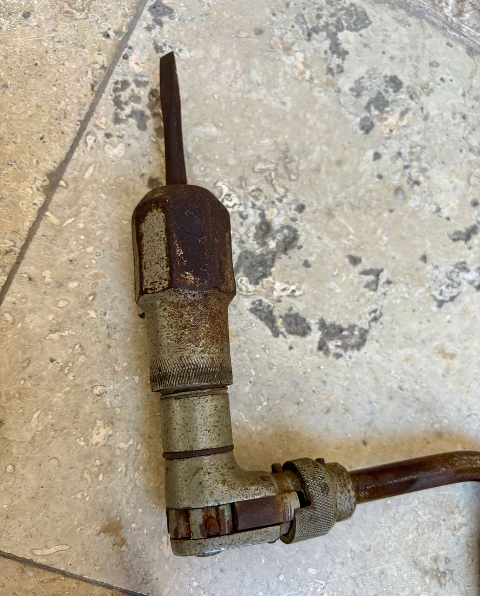 Vintage hand drill with drill bits