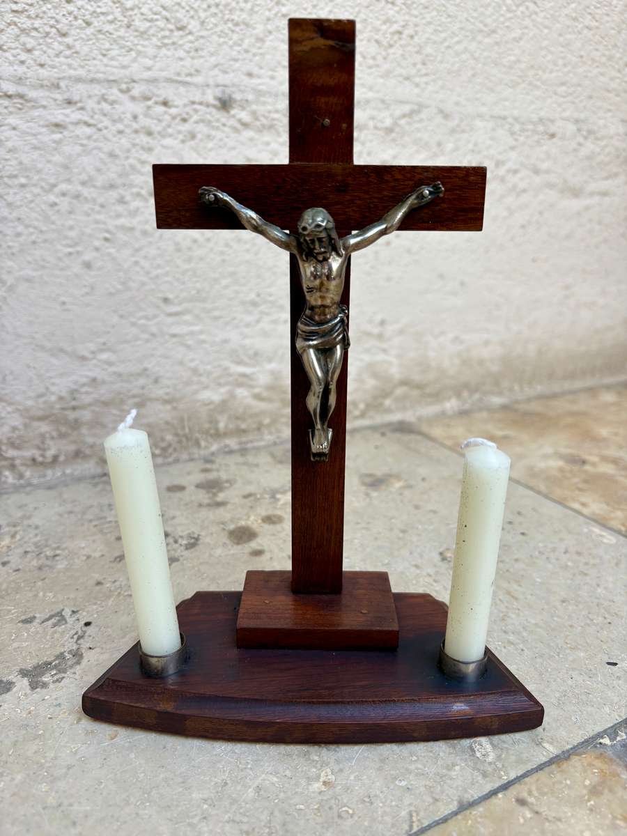 Vintage wooden crucifix with candles