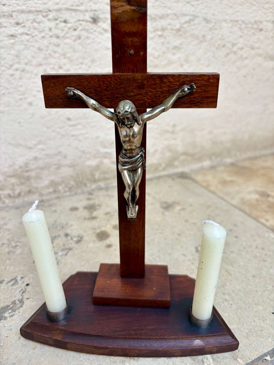 Vintage wooden crucifix with candles