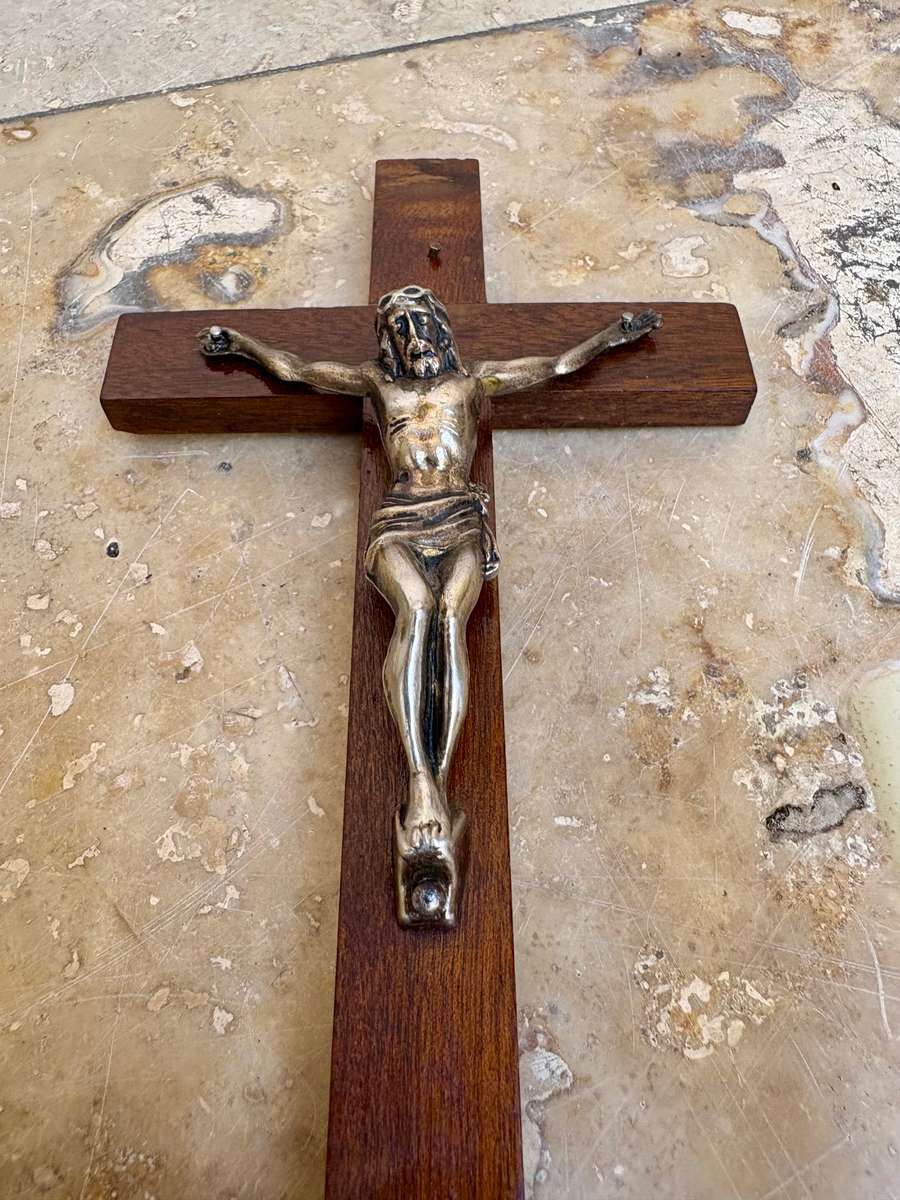 Vintage wooden crucifix with candles