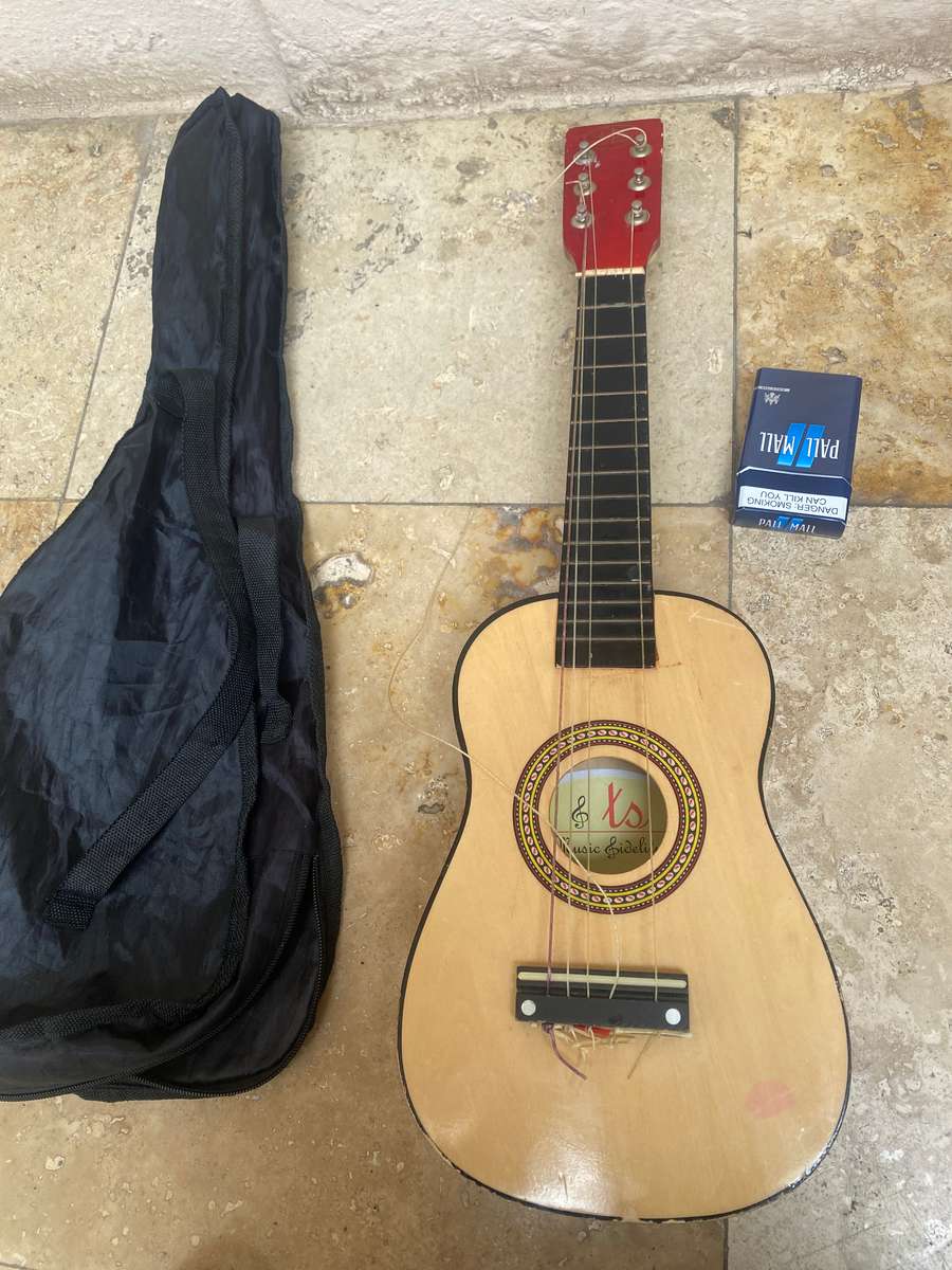 Beginners small 6 string guitar by TS music fidelity with carry bag , needs new string