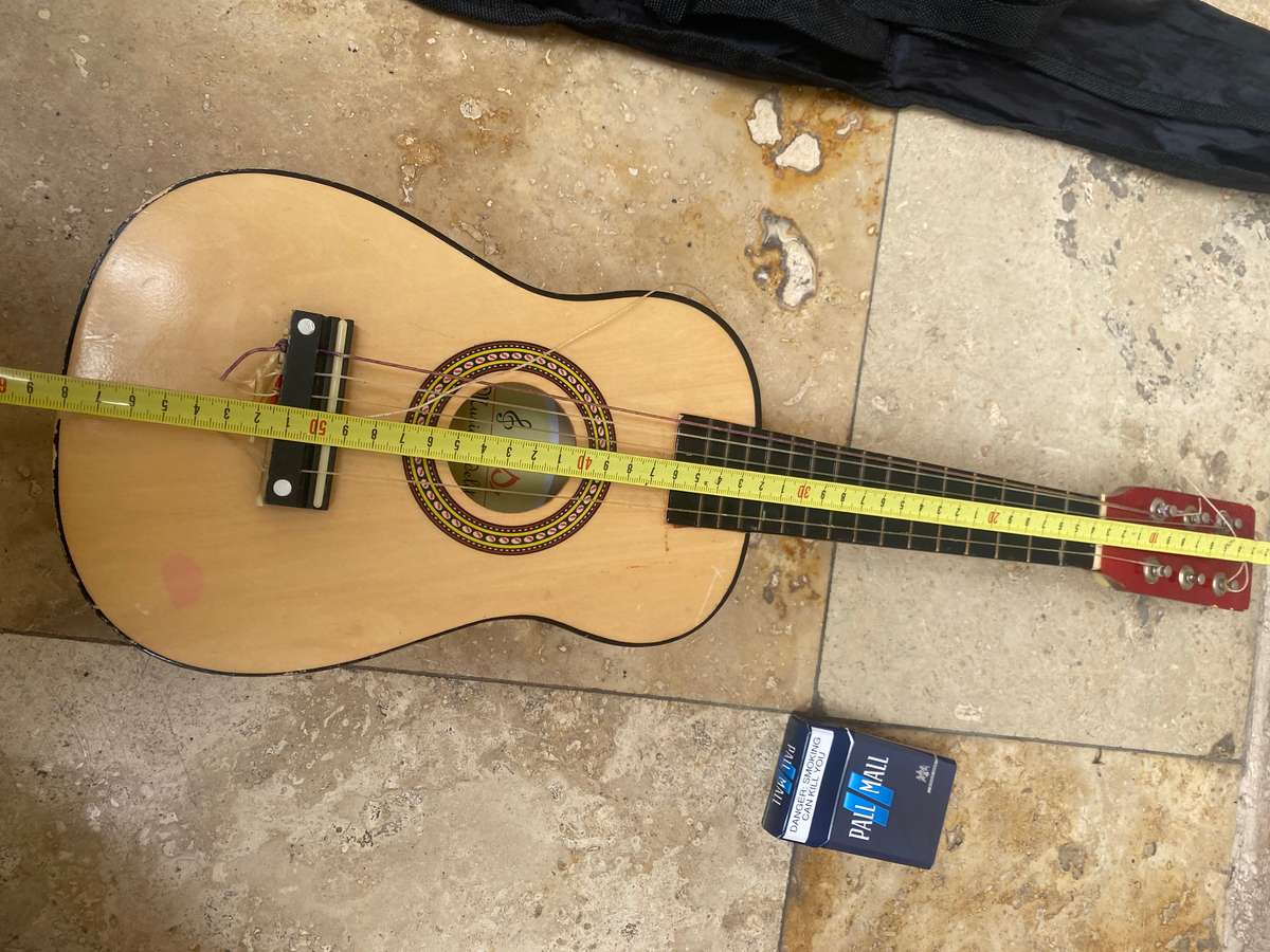 Beginners small 6 string guitar by TS music fidelity with carry bag , needs new string