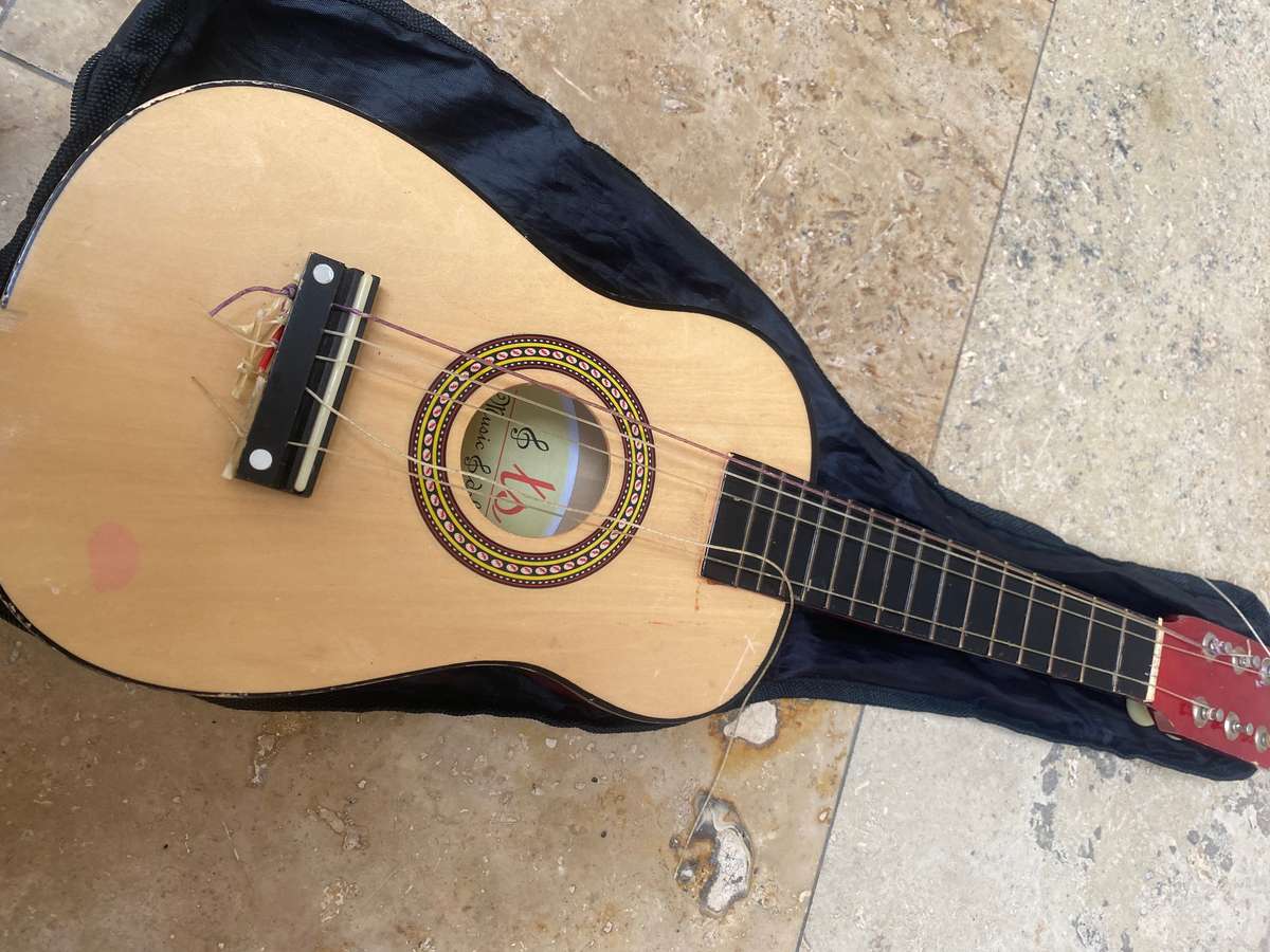 Beginners small 6 string guitar by TS music fidelity with carry bag , needs new string