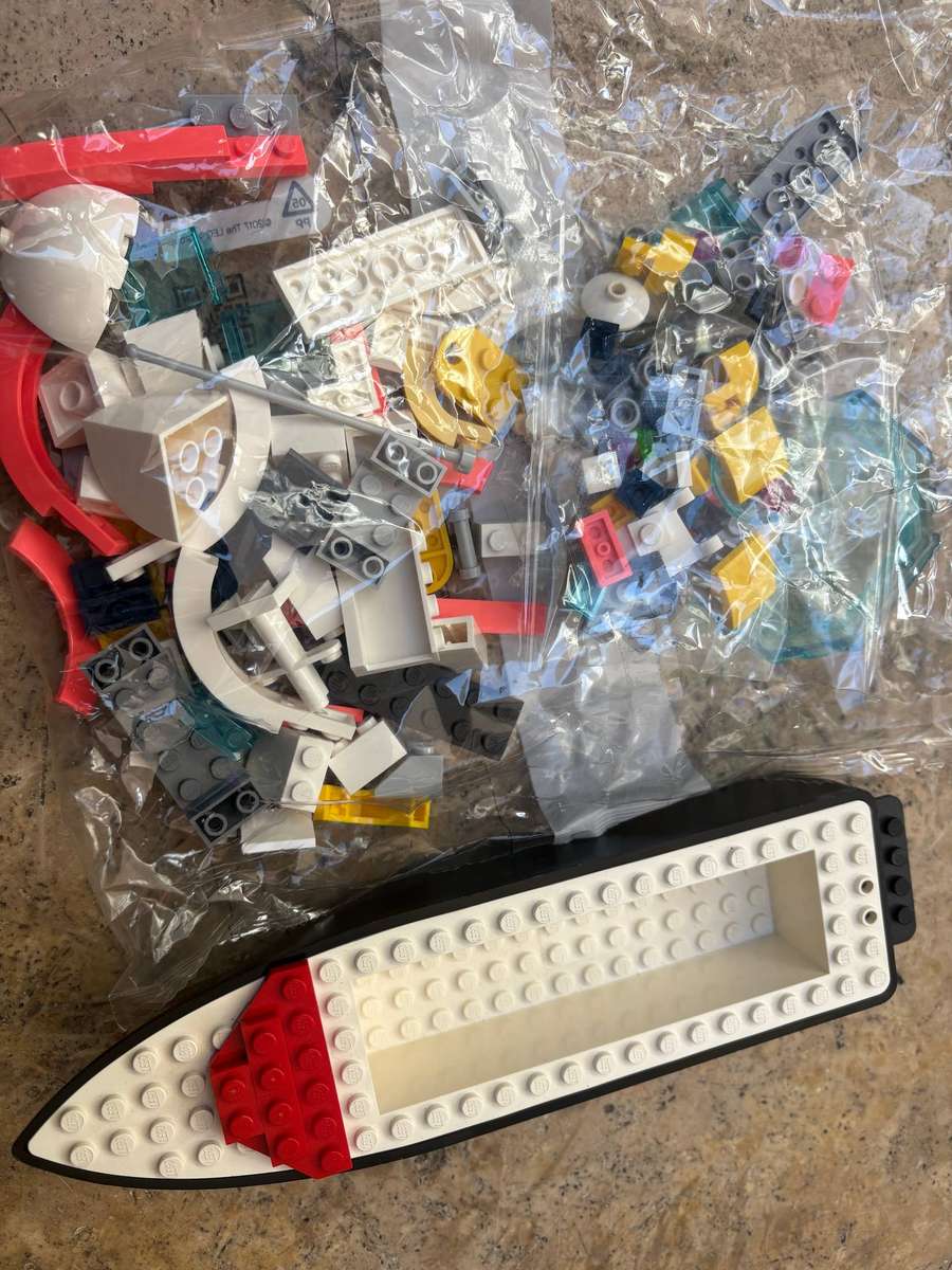 Vintage Lego boat hull riptide racer with boat building spare parts