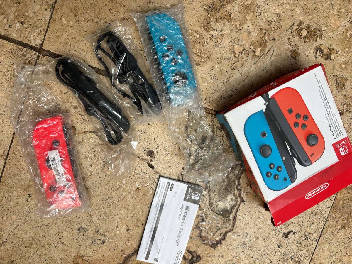 Nintendo Switch  joy con controllers neon red and neon blue