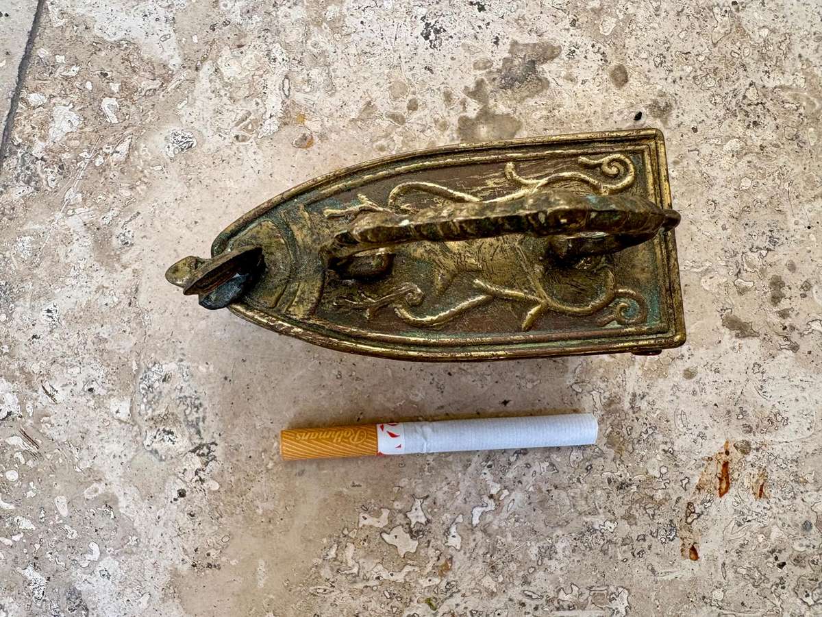 Vintage brass coal iron