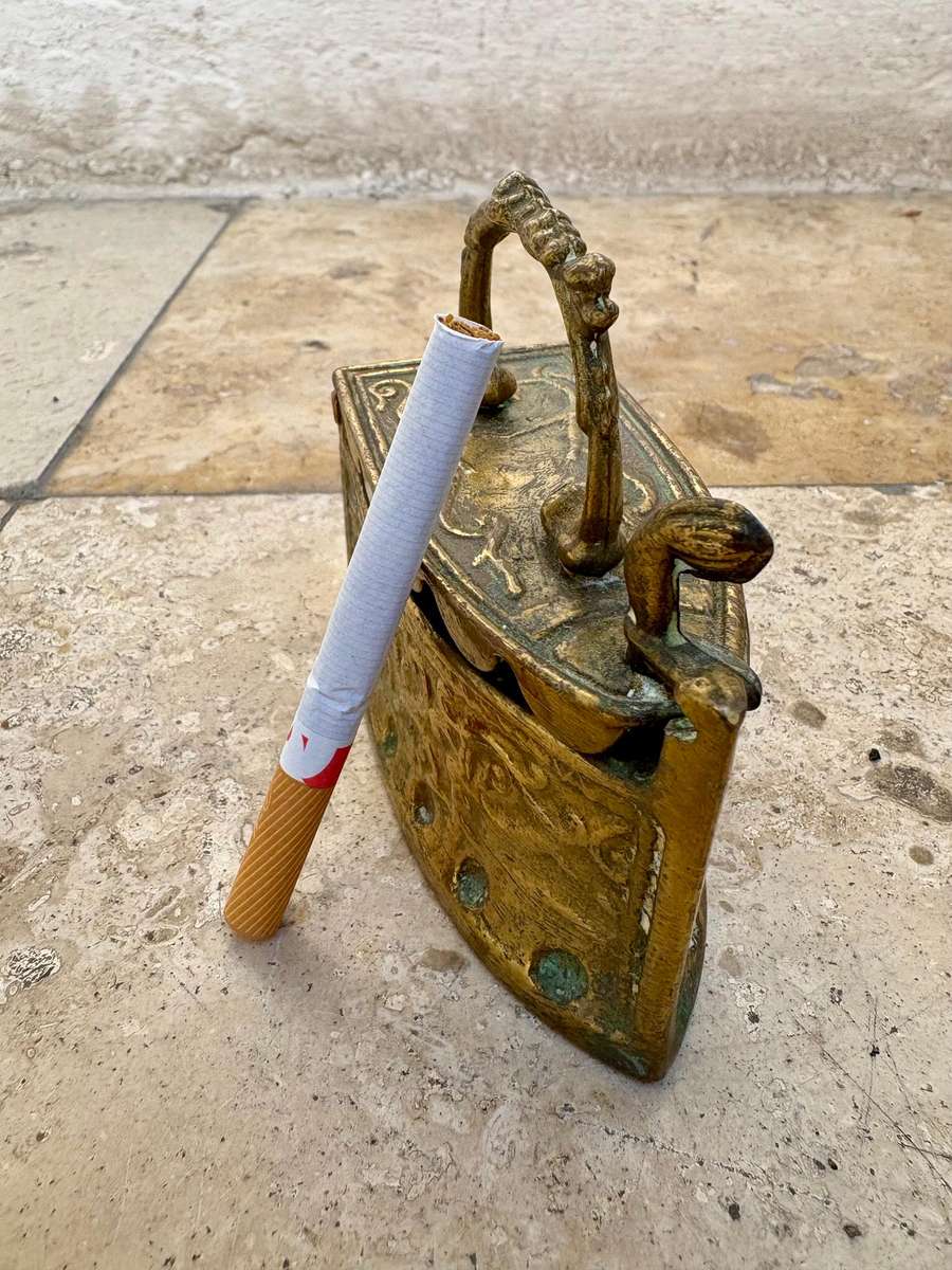 Vintage brass coal iron