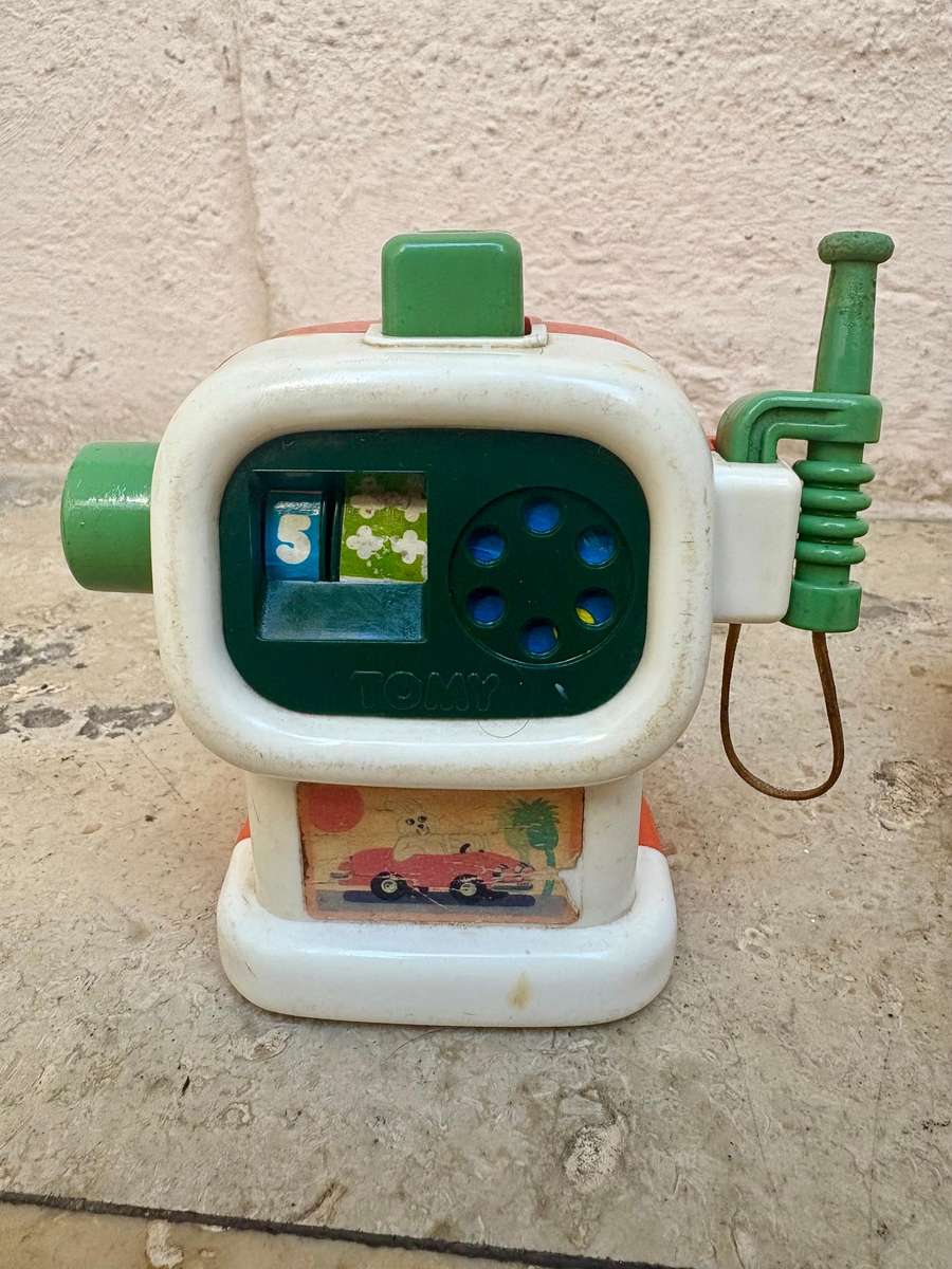 Vintage Tomy push and go car + ring a ding fuel pump 1985