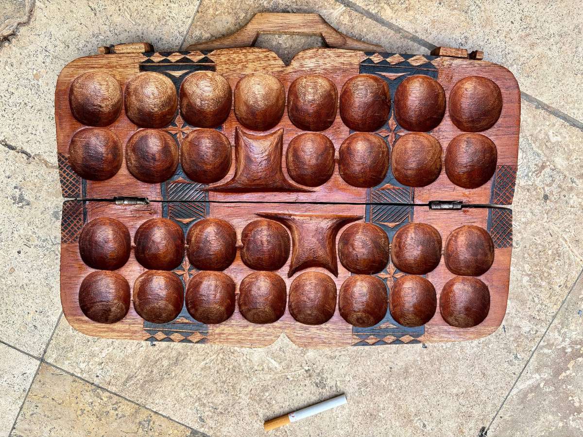 Vintage hand carved wood Mancala Bao African game board