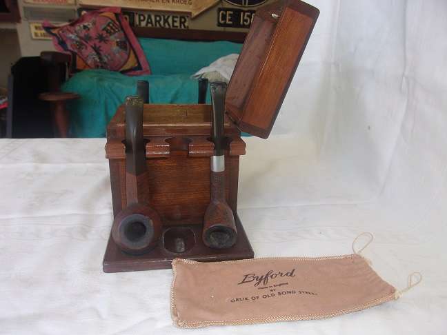 4 Vintage quality smoking pipes and a pipe stand for 1 bid