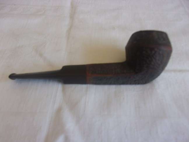 4 Vintage quality smoking pipes and a pipe stand for 1 bid
