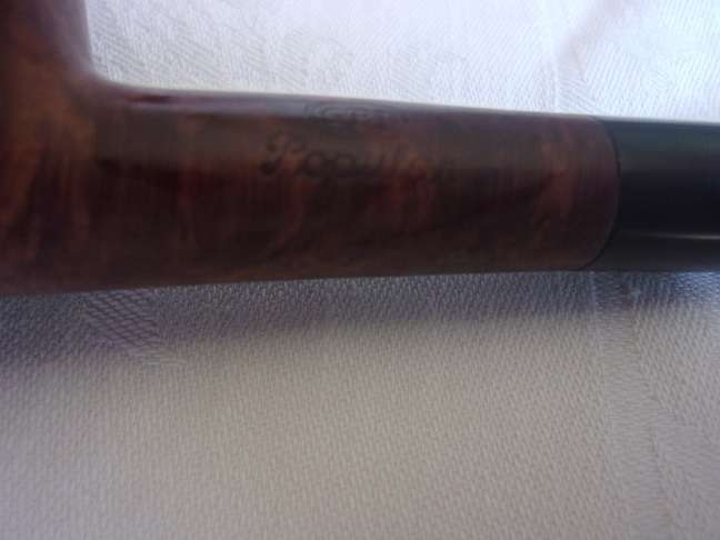 4 Vintage quality smoking pipes and a pipe stand for 1 bid