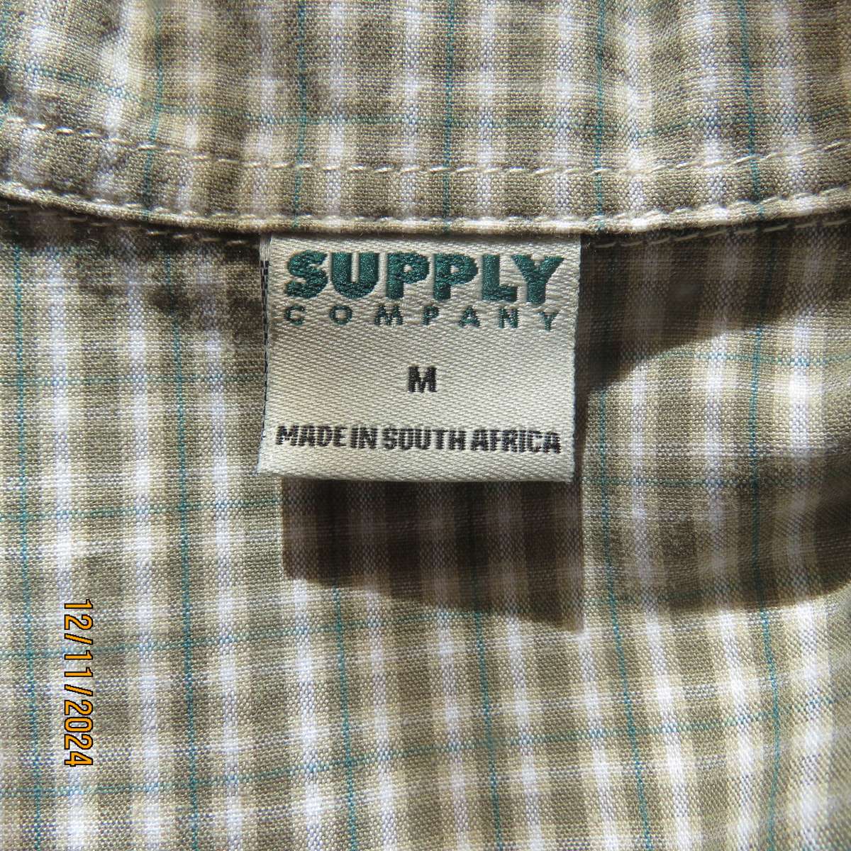 Olive green and cream check cotton button down top. Yoked front. Size 36.