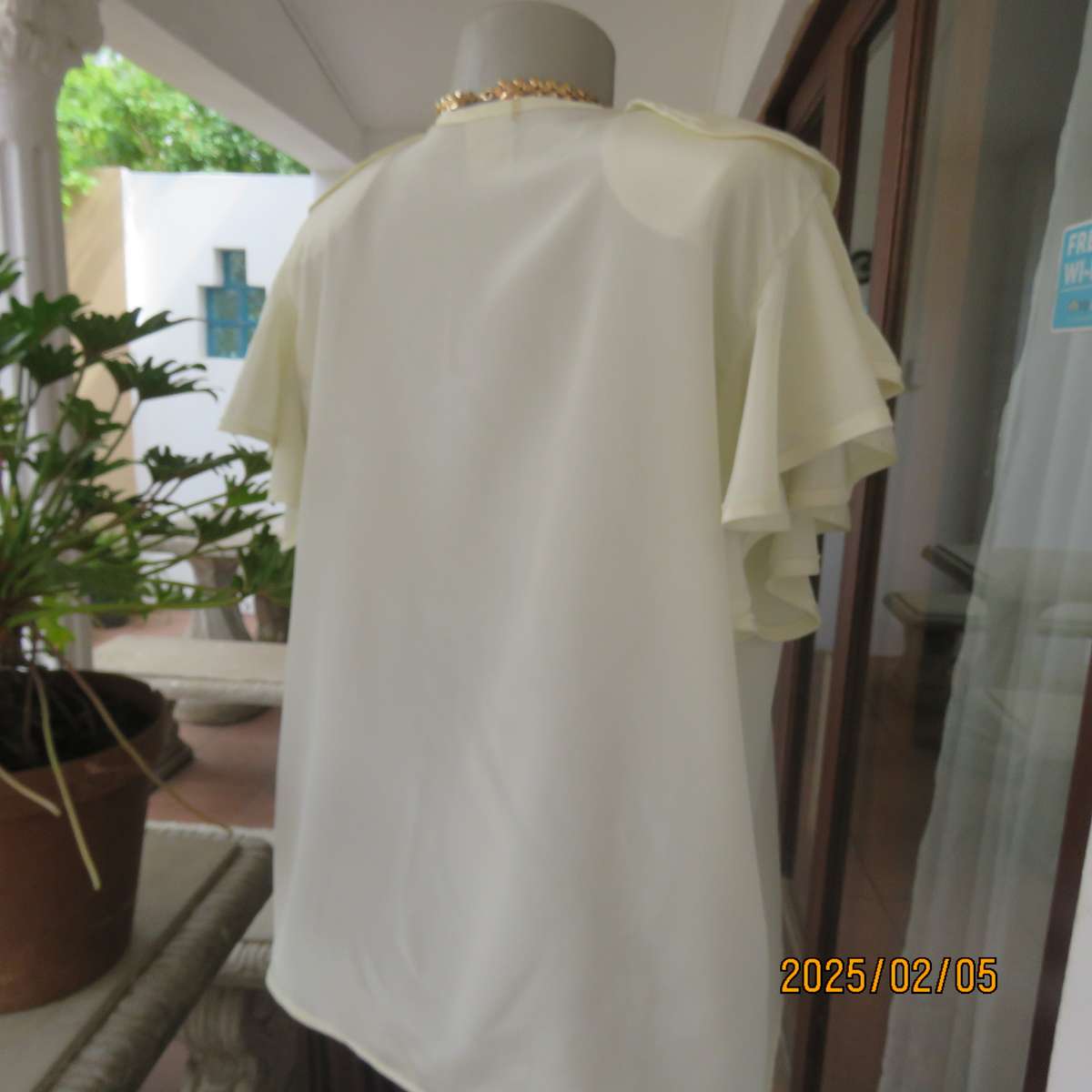 NEW DIRECTION rich cream silky polyester top. Size 42. Flare frilled armholes.Flare collar.