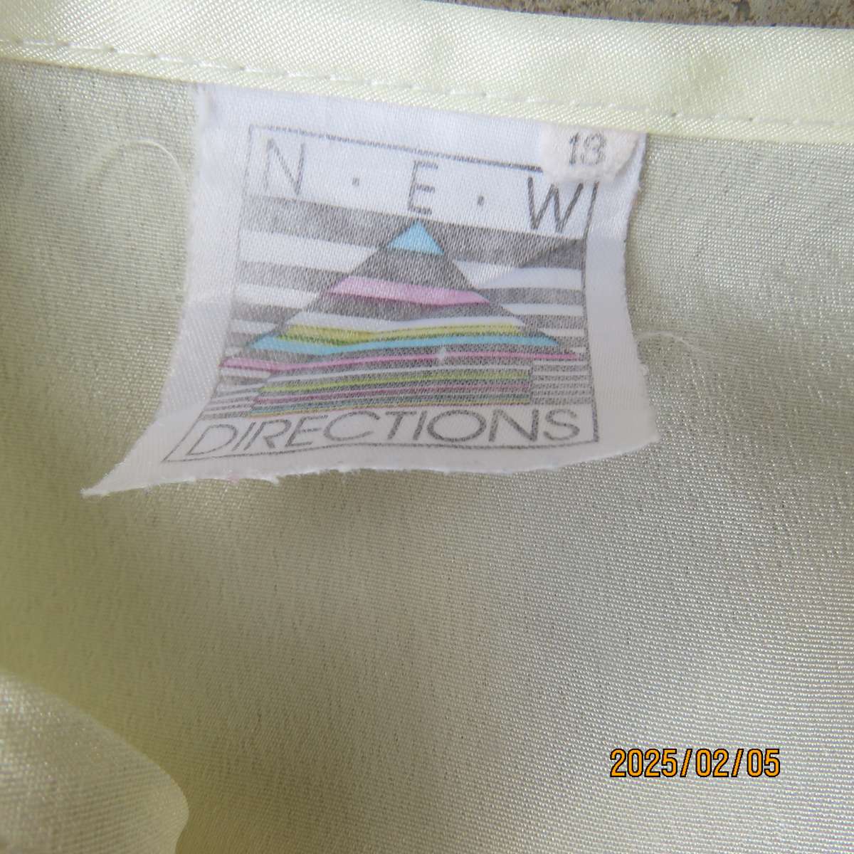 NEW DIRECTION rich cream silky polyester top. Size 42. Flare frilled armholes.Flare collar.