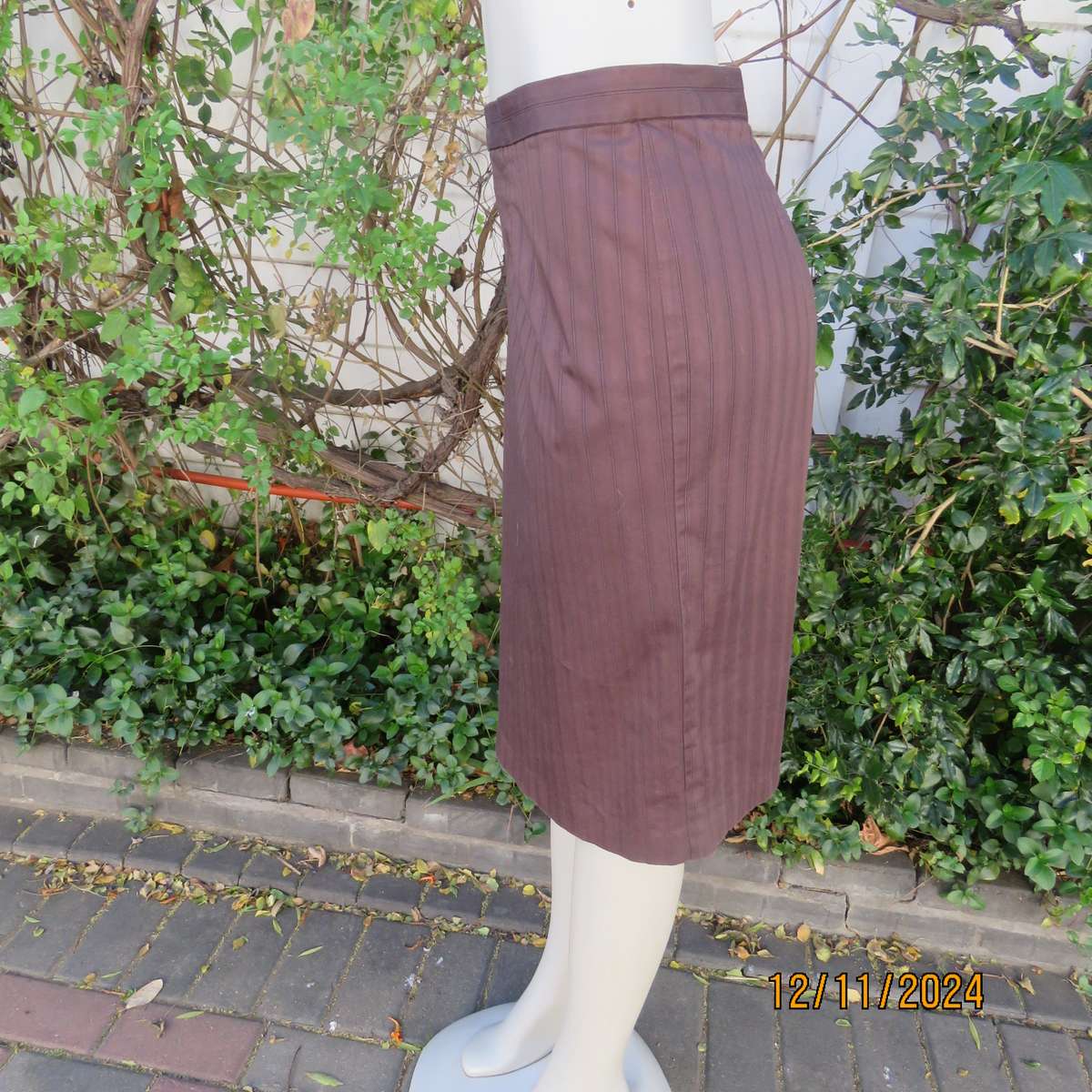 Dark brown striped firm textured stretch polyester pencil lined skirt. Size 38