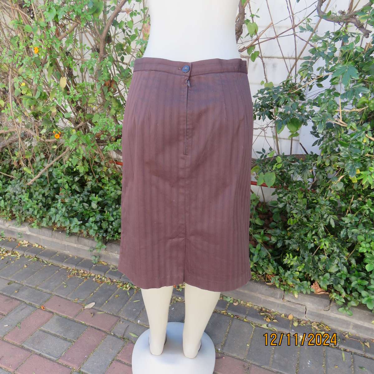 Dark brown striped firm textured stretch polyester pencil lined skirt. Size 38