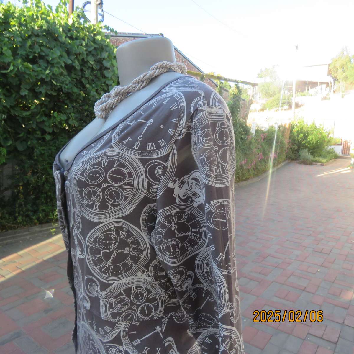 LA LIDA steel grey peplum style stretch polycotton top with white watch patterns. Size 38. As new.