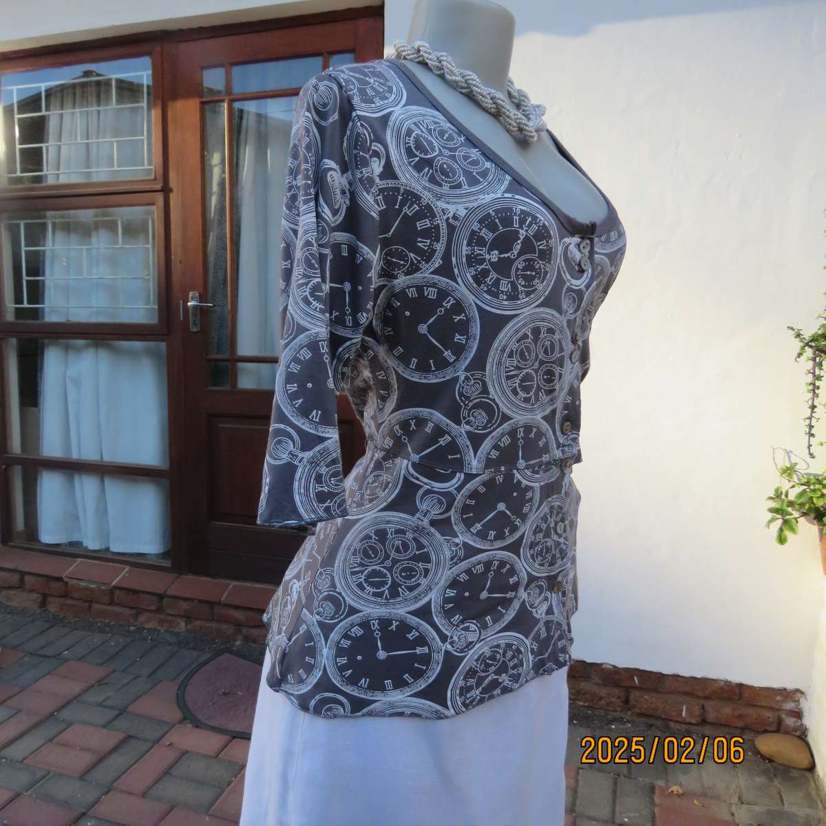 LA LIDA steel grey peplum style stretch polycotton top with white watch patterns. Size 38. As new.