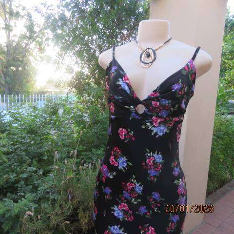 Black silky polyester with pink-blue posy strappy dress and fold over bust. Size 33