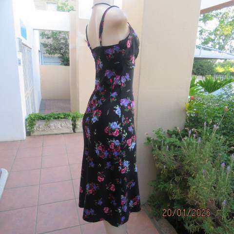 Black silky polyester with pink-blue posy strappy dress and fold over bust. Size 33
