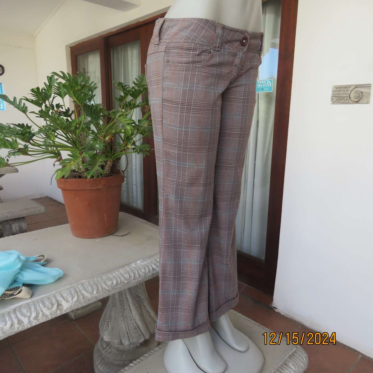Tartan check bootcut woven poly-rayon pants in autumn colours. Size 34