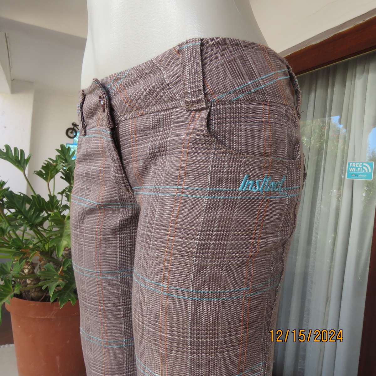 Tartan check bootcut woven poly-rayon pants in autumn colours. Size 34