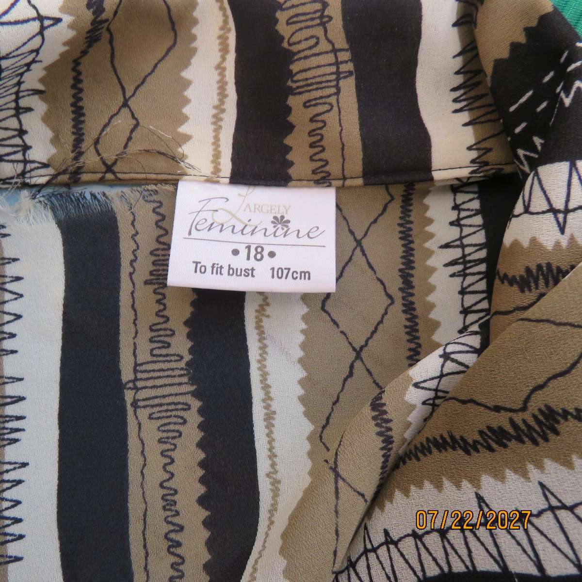 LARGELY FEMININE 2 pc polyester A-line skirt and long sleeve top outfit. Vertical striped. Size 42