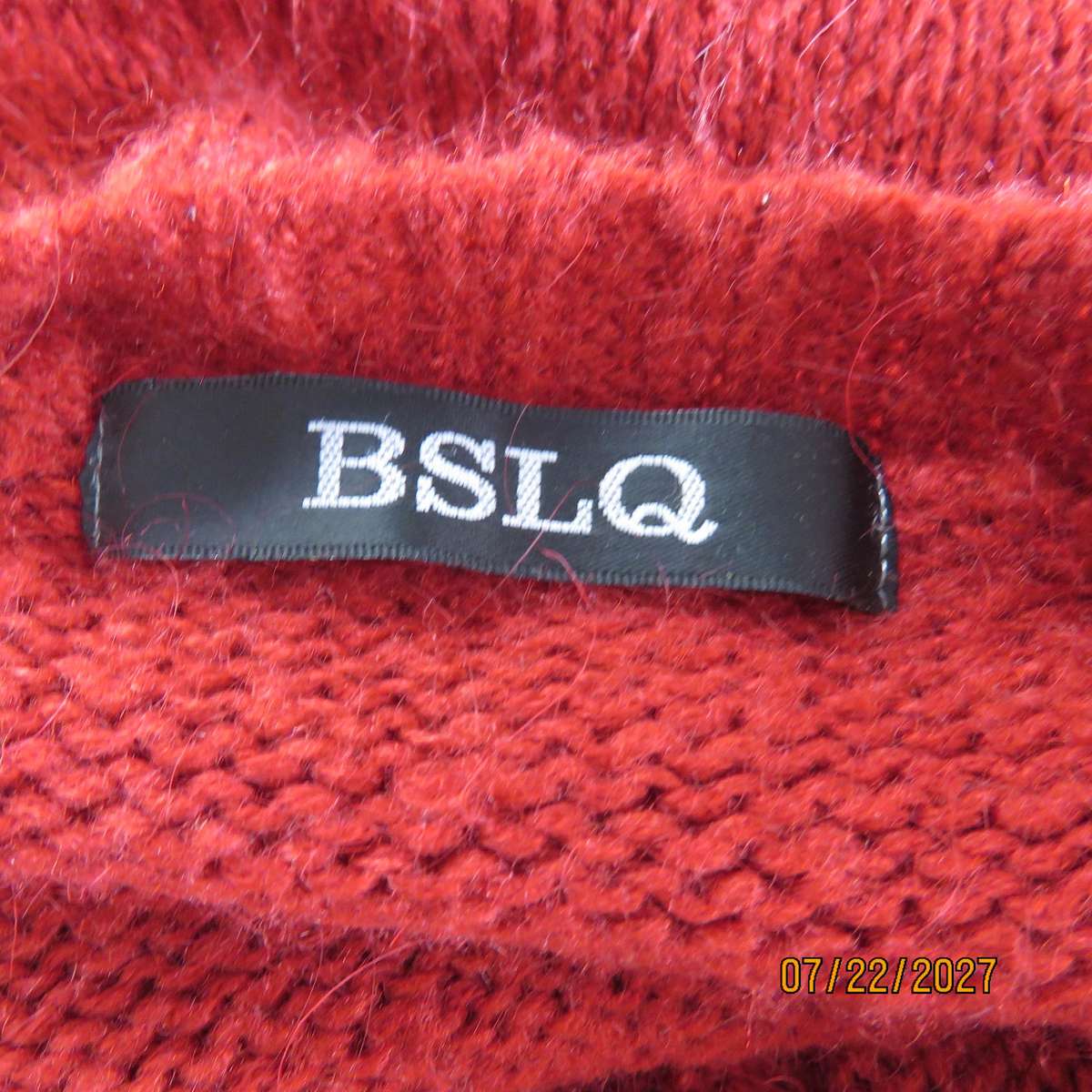 BSLQ red wool-acrylic knit long scooped neck top size 36. Unique pockets.