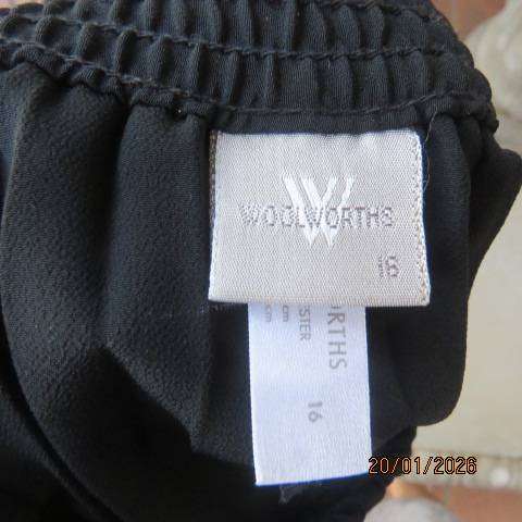 WOOLWORTHS black permanent half flare silky polyester skirt with elasticated waist. Size 40