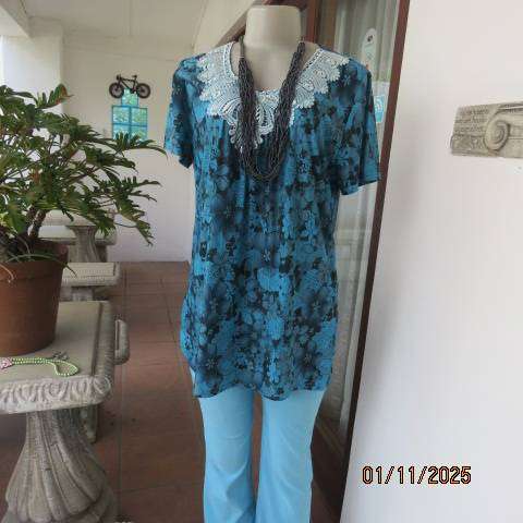 Turkish blue textured stretch polyester top with black floral print in size 38-40