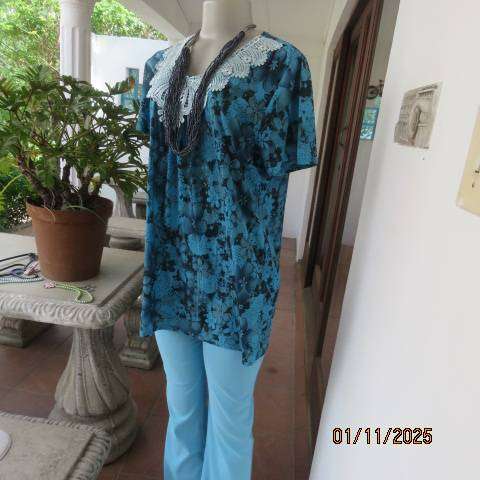 Turkish blue textured stretch polyester top with black floral print in size 38-40