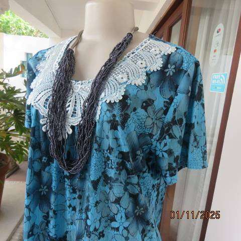 Turkish blue textured stretch polyester top with black floral print in size 38-40