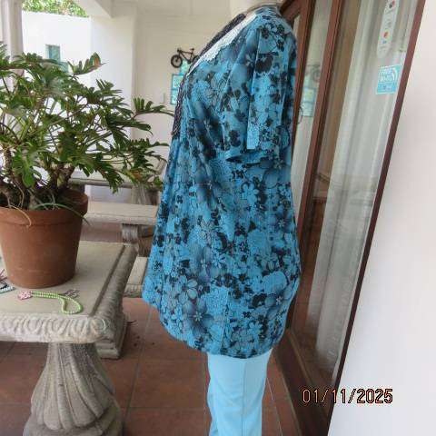 Turkish blue textured stretch polyester top with black floral print in size 38-40
