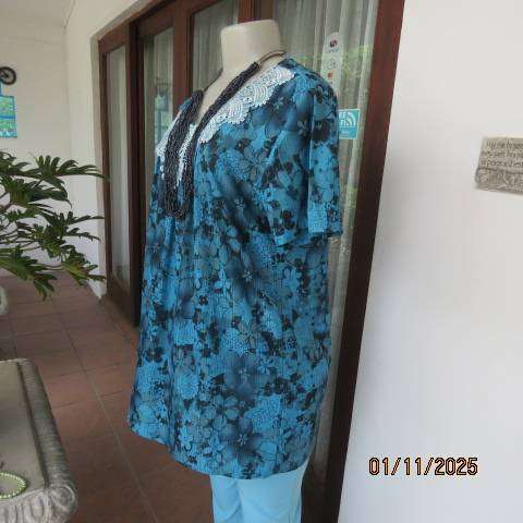 Turkish blue textured stretch polyester top with black floral print in size 38-40