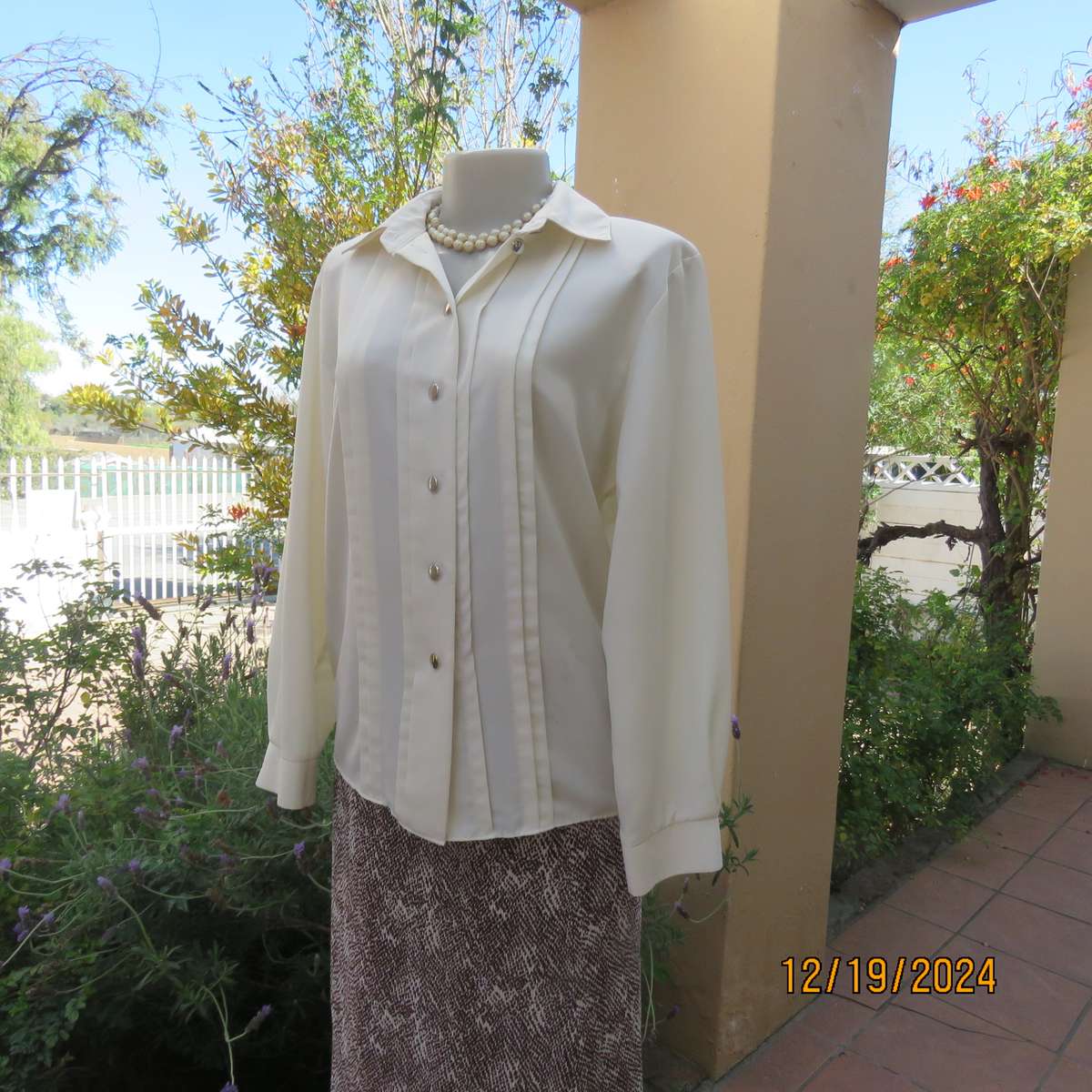 Elegant soft cream long cuffed sleeve top. Button down/shirt collar.Decorative tucked seams. Size 36